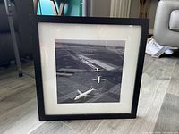 Front view of framed photo standing upright