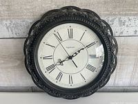 Front view of Ingraham quartz wall clock showing dial and frame