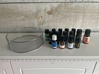 Group shot of wire basket and all essential oil bottles
