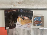 Front covers of both programs and Argonauts sticker