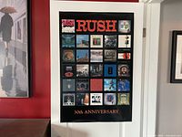 Full view of Rush 30th Anniversary poster hanging on door
