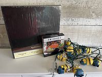 All three boxed items: storage box, Friends kit, Minions light string