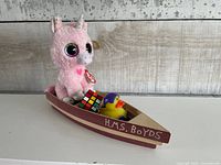All items arranged in Boyds wooden boat