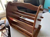 front angled view showing slatted front and carpeted base