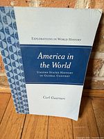 Front cover showing title, series, author, minor corner wear