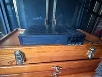 Front and top view of Funai DVD player showing tray and control buttons