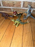 All five dinosaur figures group shot front angle