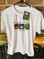 Front view of the white T-shirt showing graphic and tags