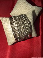 Front view showing entire cuff, openwork and braided patterns