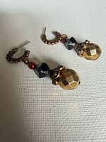 Both earrings front view showing bead arrangement and hoop detail