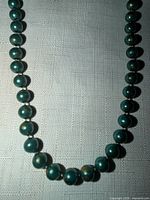 close-up of bead strand highlighting colour, finish, bead size