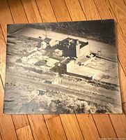 Front view of square black-and-white aerial photograph print