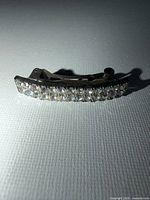 Front view showing full row of rhinestones on barrette
