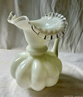 Overall view showing ruffled clear rim and handle