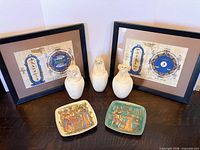 Group shot showing both framed prints, three canopic jars and two plates