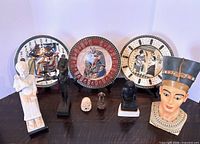 Group shot of three plates and seven figurines
