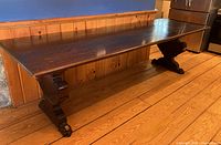 Full view of tiger oak table showing top and one pedestal base