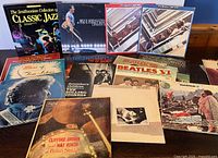 Array of LPs and Smithsonian jazz CD box displayed on table