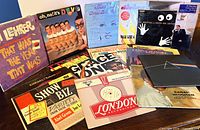 Overview of entire lot of vinyl records spread on table