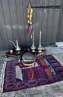 Full lot overview showing all items arranged on rug