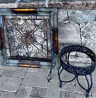 Plaque, tongs and plant stand grouped