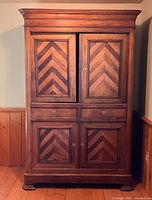 Full front view of oak armoire closed