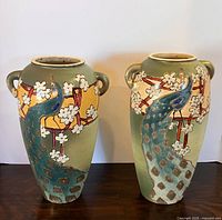 Front view of both vases showing full design, handles, and size comparison