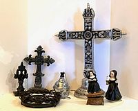 Overview of crosses, censer, mirror frame, nun music boxes, finial