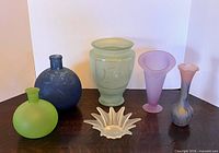 Group shot of all six pastel satin and frosted glass pieces
