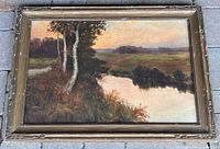 Framed landscape painting showing full composition and frame wear