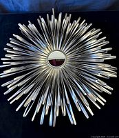 Front view of entire mirror with starburst frame