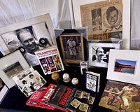 Group shot of all memorabilia: baseballs, framed photos, books