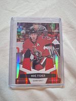 Front of card showing image, two red jersey swatches and Mirror Red foil design