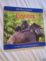 Front cover showing title, series name and young gorilla on adult’s back
