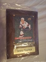 Front view showing card, plaque, and nameplate