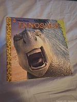 Front cover showing title and dinosaur image