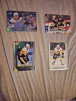 All four Evgeni Malkin cards laid out to show fronts and condition