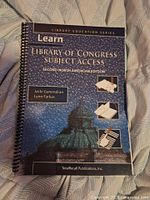 Front cover showing title, edition, authors, and spiral binding