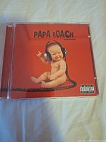 Front cover of CD jewel case showing Papa Roach lovehatetragedy artwork