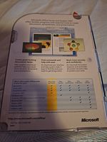 Back of clamshell case showing included programs and feature checklist