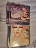 Front covers of both P!nk CD albums