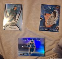 Fronts of all three Sam Dickinson Upper Deck hockey cards