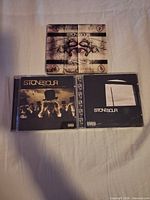 Front covers of all three Stone Sour CDs