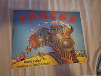 Front cover showing title, author, illustrator, locomotive illustration