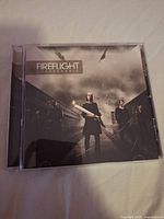 Front view of jewel case showing album cover