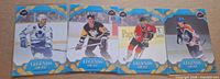 Front view of four Upper Deck Legends on Ice hockey cards featuring Gretzky, Lemieux, Chelios, Gilmour