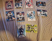 Image showing all ten William Eklund hockey cards spread out