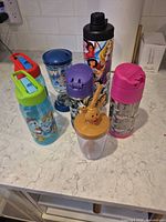All seven drinkware items grouped on countertop