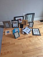 Group shot of all 13 picture frames on floor