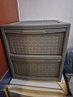 Front view of gray plastic 2-drawer organizer showing both drawers closed